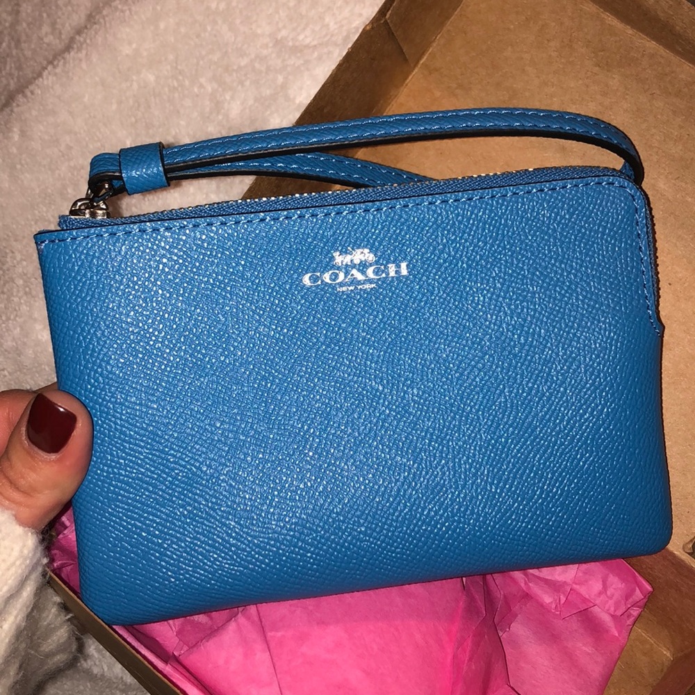 Bright blue coach wristlet